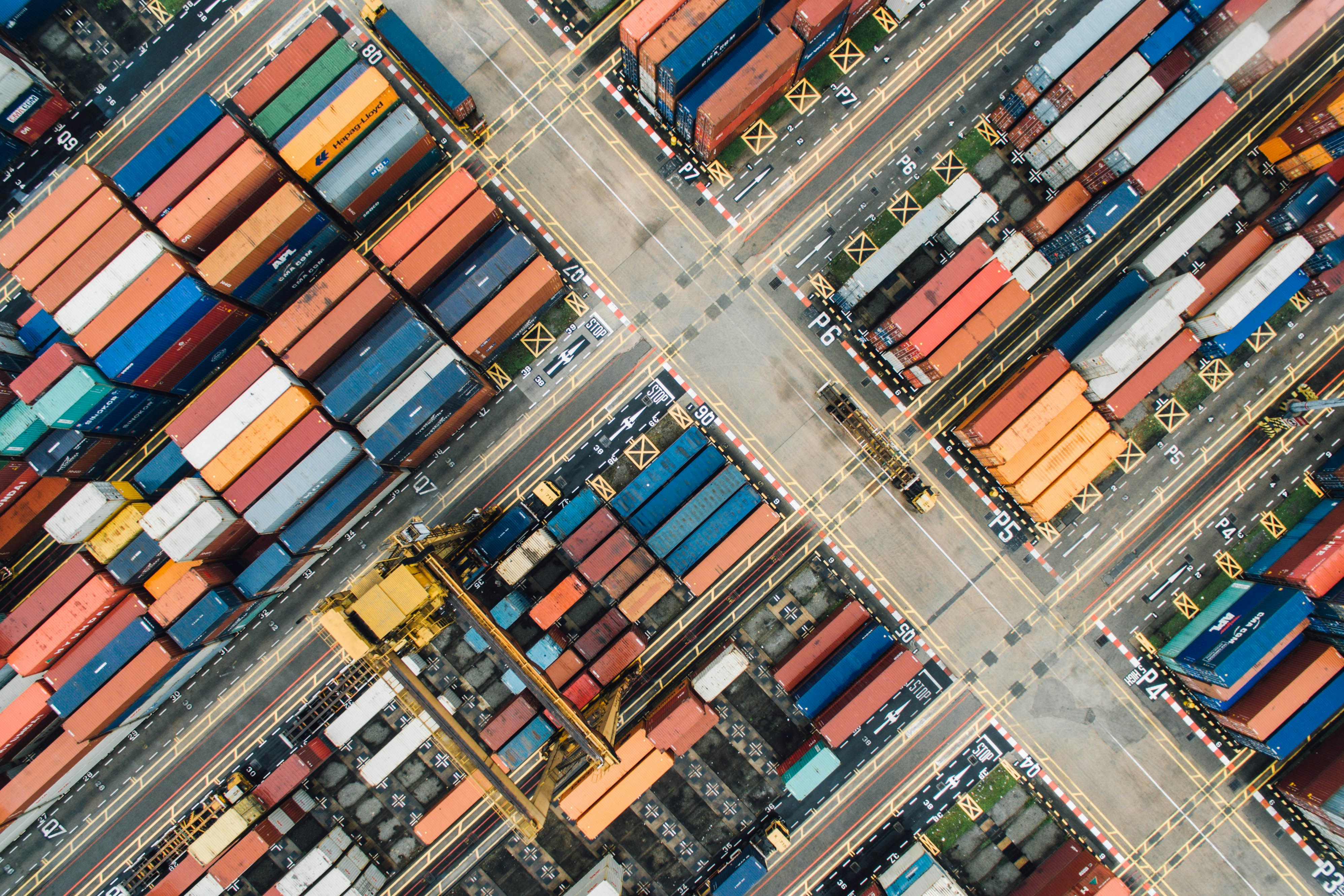 An aerial view of shipping containers in a freight terminal.